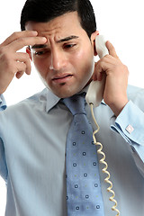 Image showing Stressed  depressed man businessman on phone