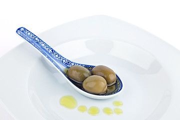 Image showing Olives on  spoon.