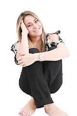 Image showing Beautiful girl sitting in the floor, isolated on white