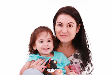 Image showing Smiling embracing mom and daughter looking at camera 