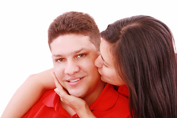 Image showing Young woman kissing her boyfriend 