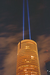 Image showing Round building with two spotlights at night