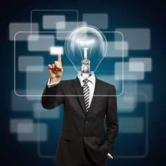 Image showing businessman with lamp-head push the button