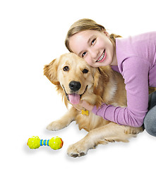 Image showing Girl hugging golden retriever dog
