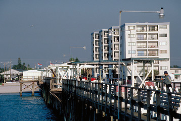 Image showing Fishing pier with hotels in background