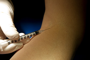 Image showing Hand in white gloves handle insulin injection