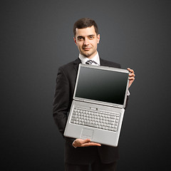 Image showing businessman with open laptop in his hands