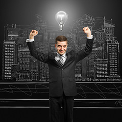 Image showing lamp-head businessman with hands up