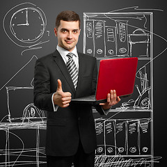 Image showing male in suit with laptop in his hands