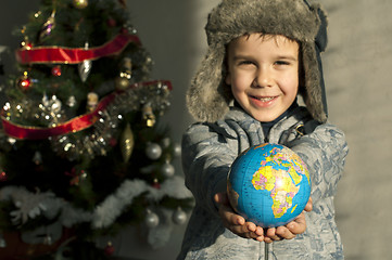 Image showing Child who give as gift the world