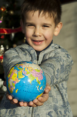 Image showing Child who give as gift the world