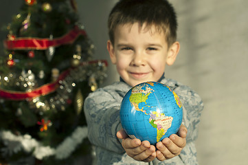 Image showing Child who give as gift the world