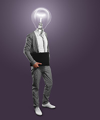 Image showing lamp head businessman with laptop