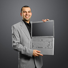 Image showing businessman with open laptop in his hands