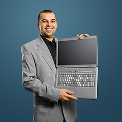 Image showing businessman with open laptop in his hands