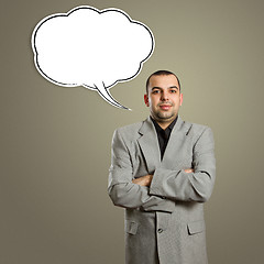 Image showing male in suit with crossed hands and speech bubble