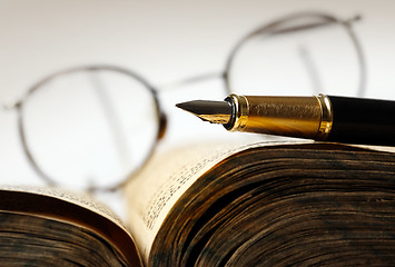 Image showing Old book and pen