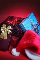 Image showing Christmas gift and santa hat