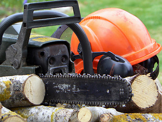 Image showing Chainsaw and helmet