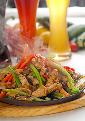 Image showing original fajita sizzling hot  on iron plate