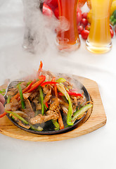 Image showing original fajita sizzling hot  on iron plate