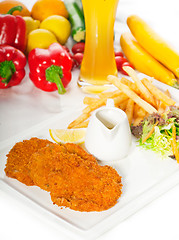 Image showing classic Milanese veal cutlets and vegetables