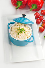 Image showing mac and cheese on a blue little clay pot