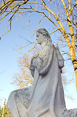 Image showing Dirty old white angel statue without wings.