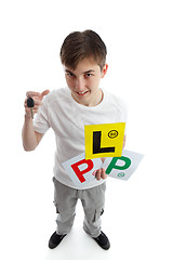 Image showing Teenager with learner driver licence plates 