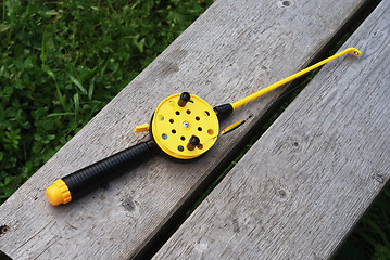 Image showing fishing rod with yellow reel 