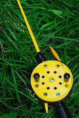 Image showing fishing rod with yellow reel  