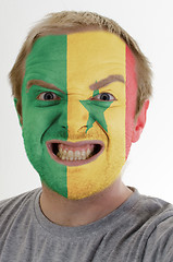 Image showing Face of crazy angry man painted in colors of senegal flag