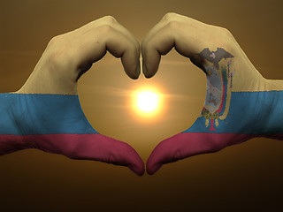 Image showing Heart and love gesture by hands colored in ecuador flag during b