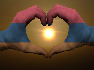 Image showing Heart and love gesture by hands colored in armenia flag during b