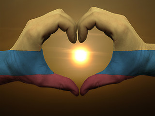 Image showing Heart and love gesture by hands colored in columbia flag during 