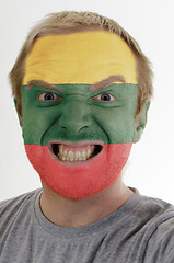 Image showing Face of crazy angry man painted in colors of lithuania flag