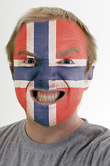 Image showing Face of crazy angry man painted in colors of norway flag