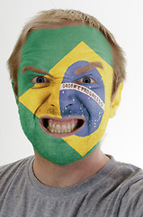 Image showing Face of crazy angry man painted in colors of brazil flag