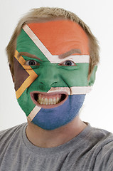 Image showing Face of crazy angry man painted in colors of south africa flag