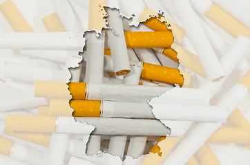 Image showing Outline map of Germany with transparent cigarettes in background