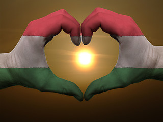 Image showing Heart and love gesture by hands colored in hungary flag during b