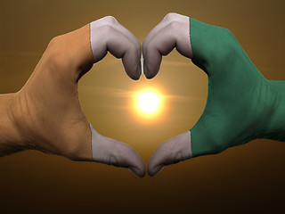 Image showing Heart and love gesture by hands colored in cote'd ivore flag dur