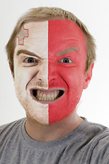 Image showing Face of crazy angry man painted in colors of malta flag