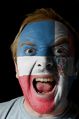 Image showing Face of crazy angry man painted in colors of dominican flag