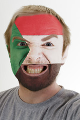 Image showing Face of crazy angry man painted in colors of Sudan flag