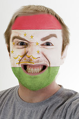 Image showing Face of crazy angry man painted in colors of Tajikistan flag