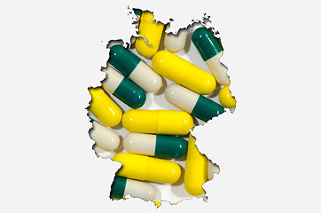 Image showing Outline map of Germany with pills in background