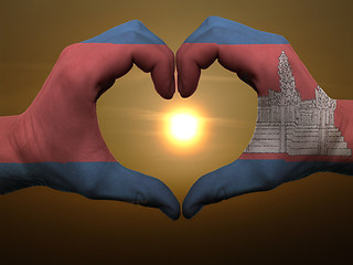 Image showing Heart and love gesture by hands colored in cambodia flag during 