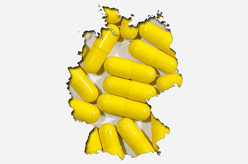 Image showing Outline map of Germany with pills in background