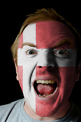 Image showing Face of crazy angry man painted in colors of denmark flag